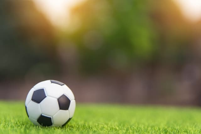 Football ball on a field