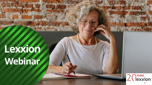 older woman sitting at the table, writting