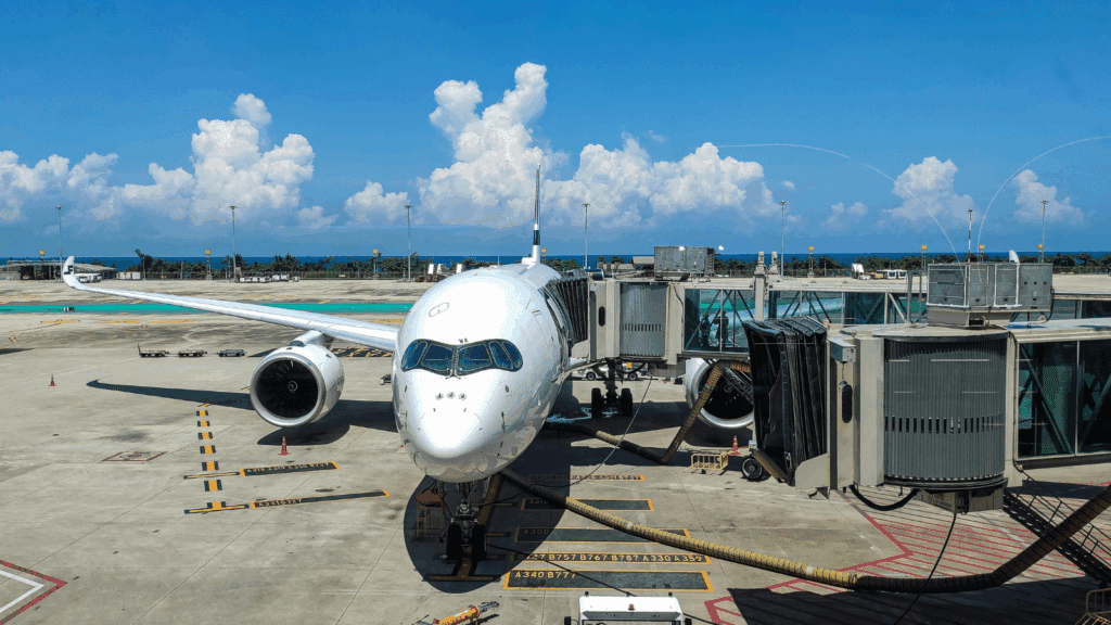 A commercial passenger airplane parked at an airport terminal gate, representing the Timișoara airport state aid case.